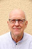 Norbert Bender ist seit Oktober 2023 Vorsitzender des Vorstandes der BVSS Portrait eines Mannes Anfang 60 mit modernem Look, er trägt Brille, lächelt zurückhaltend.